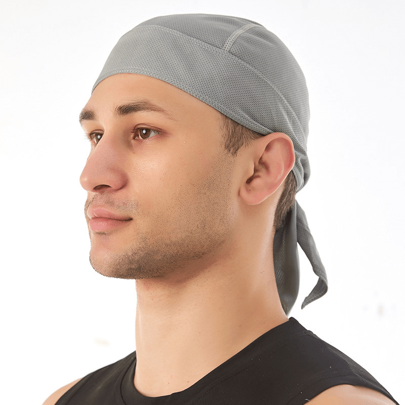 Man wearing grey quick dry cycling cap with UV protection, side profile view.