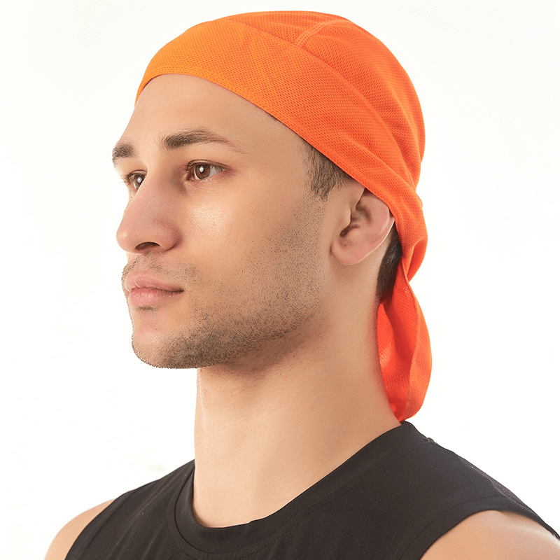 Man wearing orange Quick Dry Cycling Cap for UV protection and sweat control.