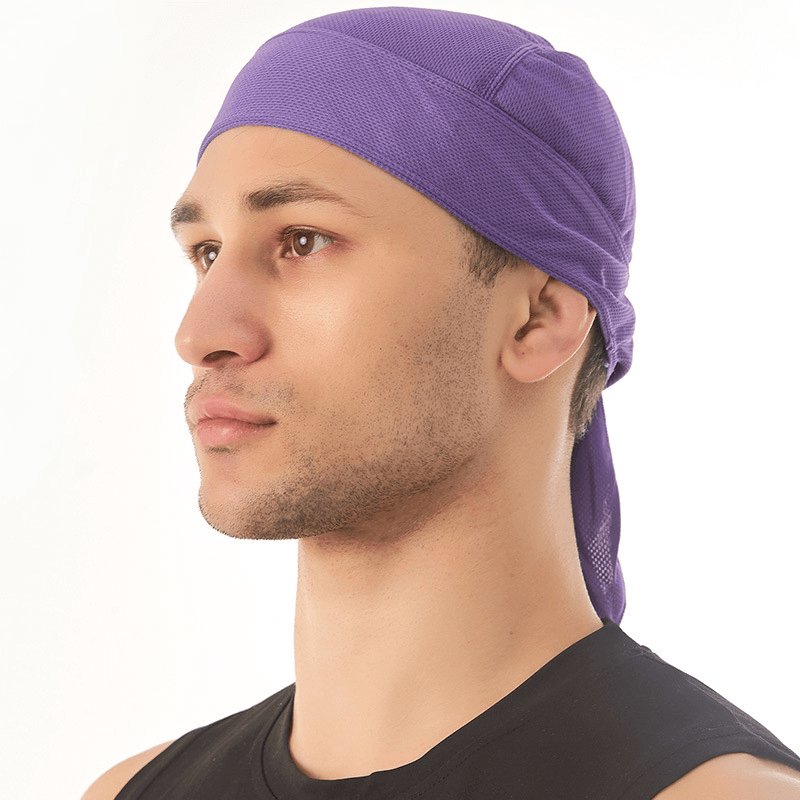 Man wearing a quick dry purple cycling cap with UV protection, highlighting its lightweight polyester fabric, perfect for outdoor activities.