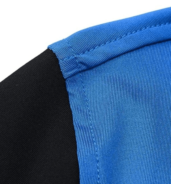 Close-up of blue and black quick-dry hooded training jacket fabric, highlighting elastic seams and stitching details for comfort.