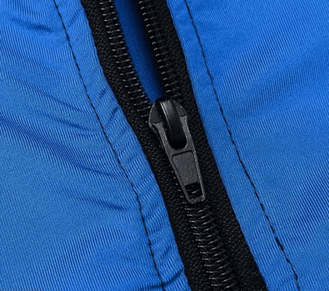 Close-up of blue quick-dry training jacket zipper; SF1870 men's hooded elastic jacket for breathable workouts.