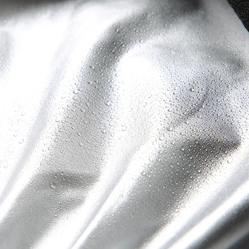 Close-up of quick-dry polyester fabric with water droplets, showcasing the water-resistant feature of the Quick Dry Hooded Running Tracksuit for Men.