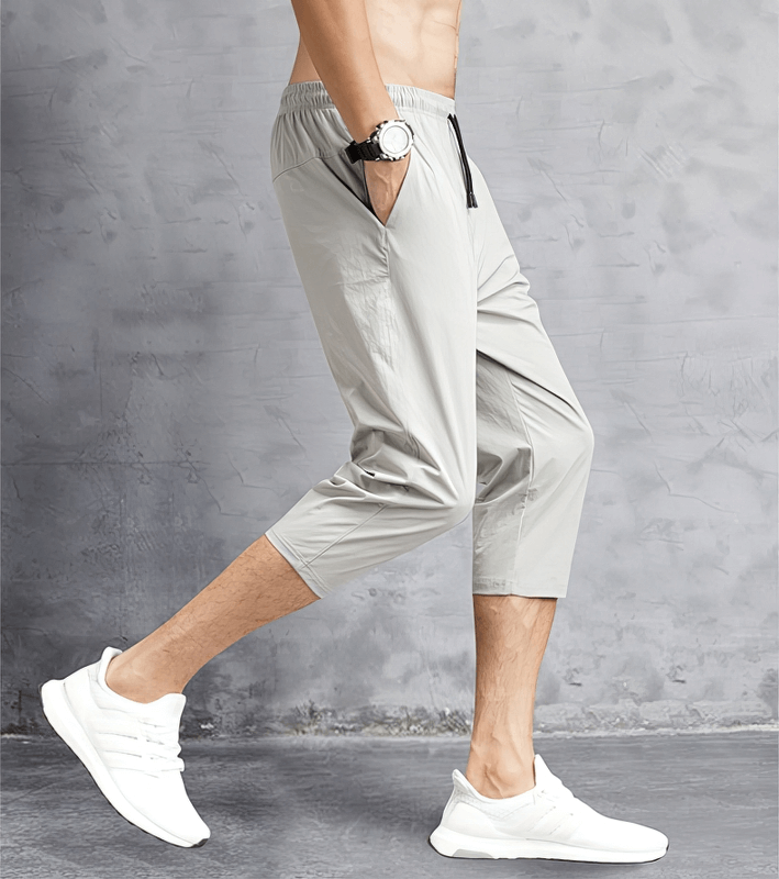 Quick dry lightweight men's extended shorts with side pockets, featuring a sleek gray design for casual style and comfort.