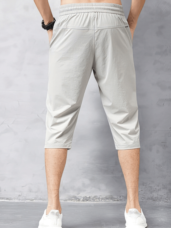 Back view of gray Quick Dry Lightweight Men's Extended Shorts with side pockets and elastic waistband.