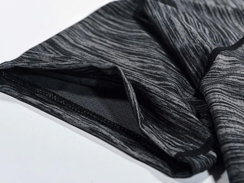 Close-up of Quick-Dry Round Neck Running T-Shirt for Men, showcasing breathable, moisture-wicking polyester fabric in a stylish solid pattern.