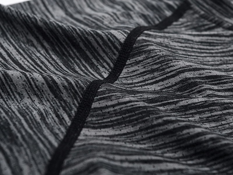 Close-up of grey Quick-Dry Running T-Shirt fabric with stylish solid pattern, illustrating breathable and moisture-wicking quality.