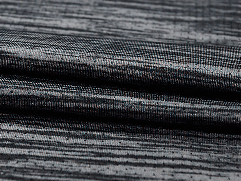Close-up of the breathable, quick-dry fabric texture used in men's running t-shirt, showcasing its high-quality polyester material.