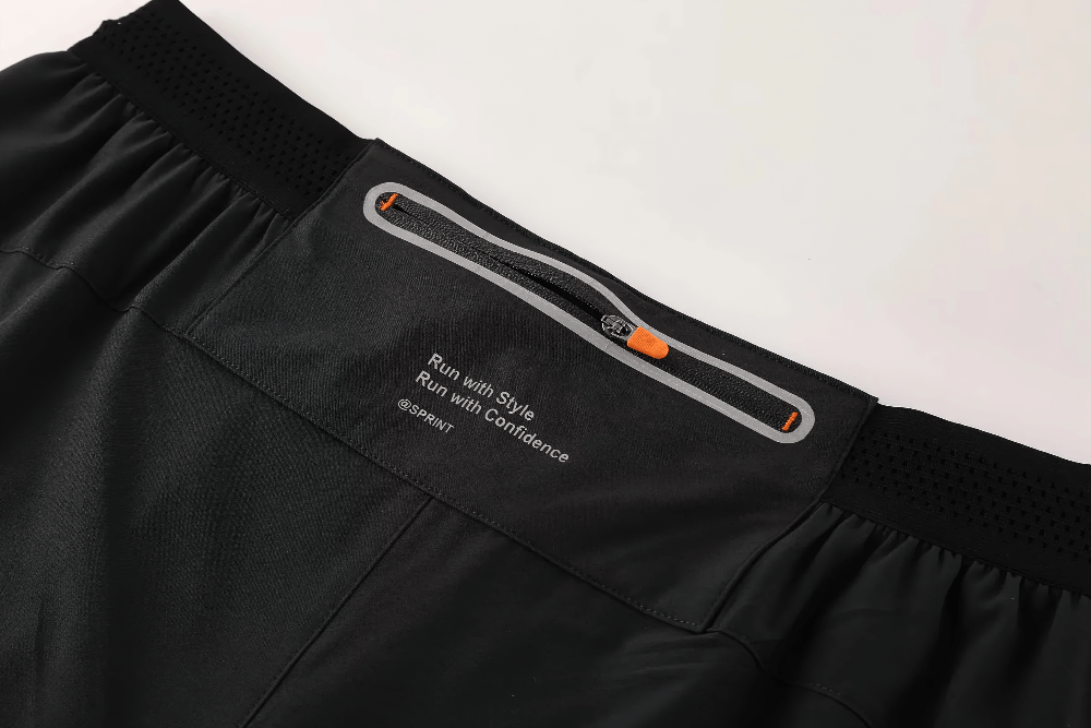 Alt Tag: Quick Dry Running Shorts with Rear Zip Pocket - SF4479 close-up of rear zip pocket and elastic waistband on black training shorts
