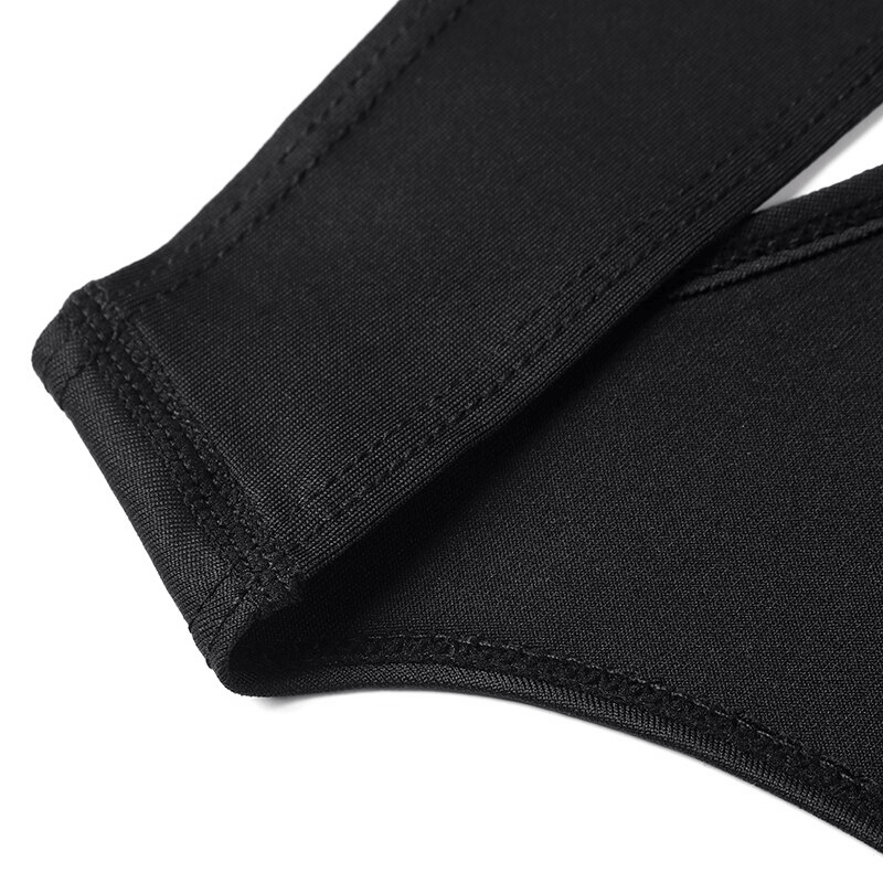 Close-up view of a black quick-dry sleeveless yoga top showing breathable acetate fabric and seam detail for fitness comfort.