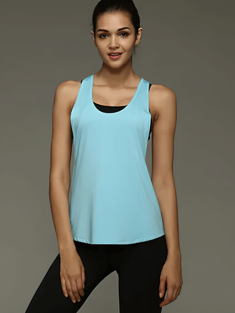 Woman wearing a blue quick-dry sleeveless yoga top for women, perfect for running and fitness activities, ensuring comfort and breathability.