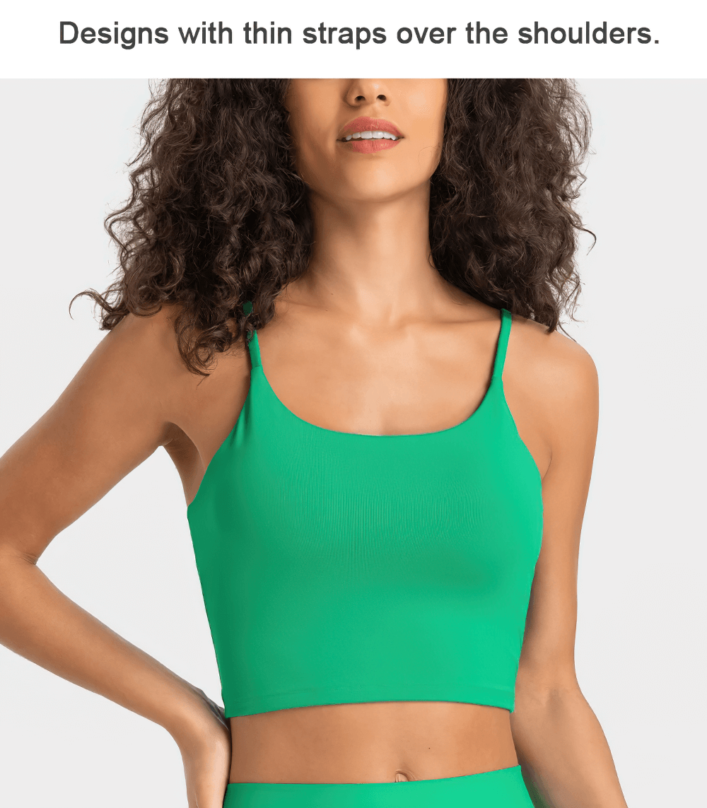 Woman wearing a green sleeveless crop top from the Quick Dry Solid Color Yoga Set, featuring thin shoulder straps, ideal for workouts.