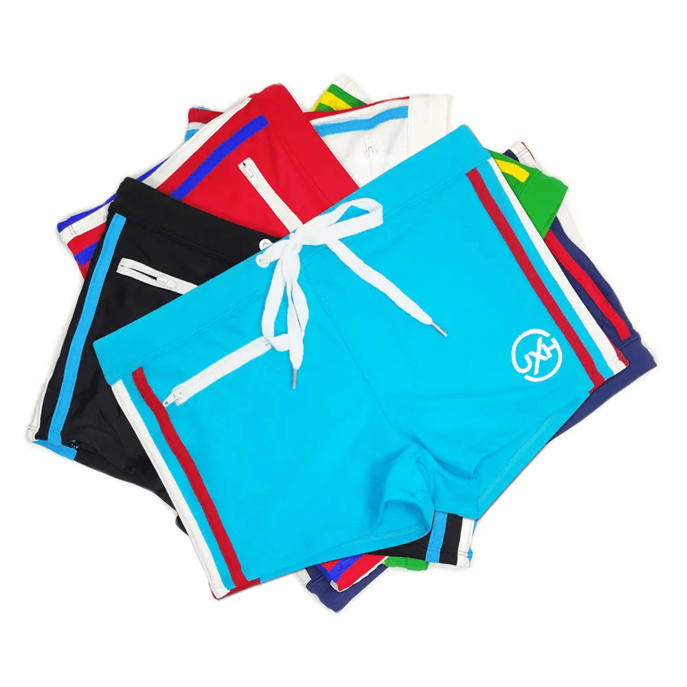 Quick-Dry Swim Trunks with Zipper Pocket - SF4714 in vibrant colors piled together for summer fun.