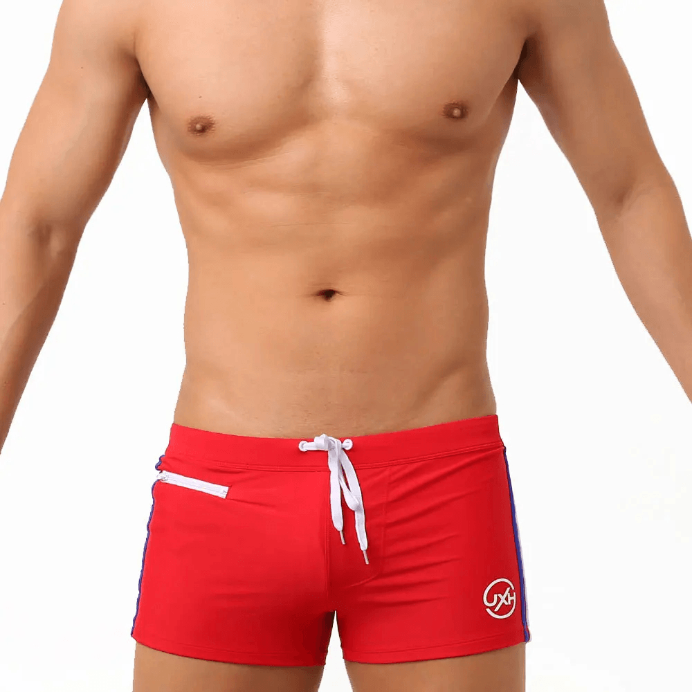 Quick-Dry Swim Trunks with Zipper Pocket - SF4714 in red, showcasing a low-rise fit and stylish design.