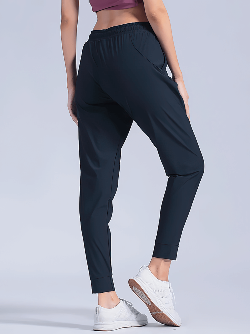 Alt Tag: Quick-Dry Women's Running Pants with Pockets - SF4395 black tapered joggers with elastic waistband, cuffed ankles and side pockets