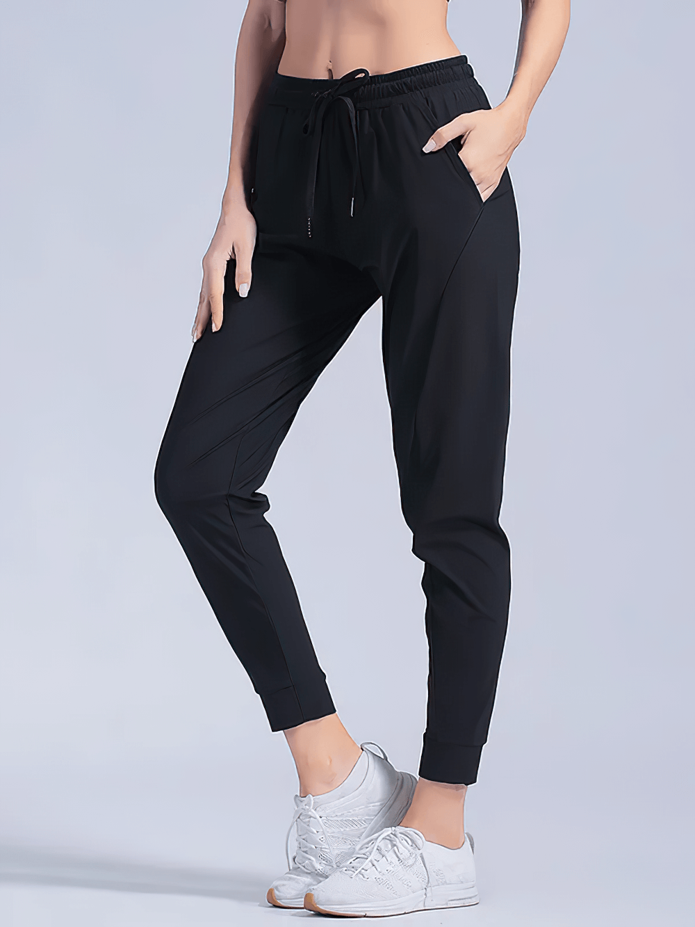 Alt Tag: Quick-Dry Women's Running Pants with Pockets - SF4395 black tapered jogger pants with drawstring waist, cuffed ankles, and side pockets