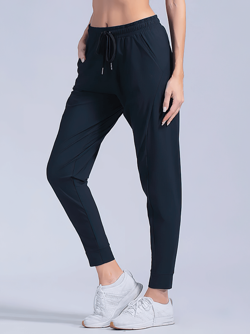 Alt Tag: Quick-Dry Women's Running Pants with Pockets - SF4395 black tapered joggers with drawstring waist, cuffed ankles, side pockets