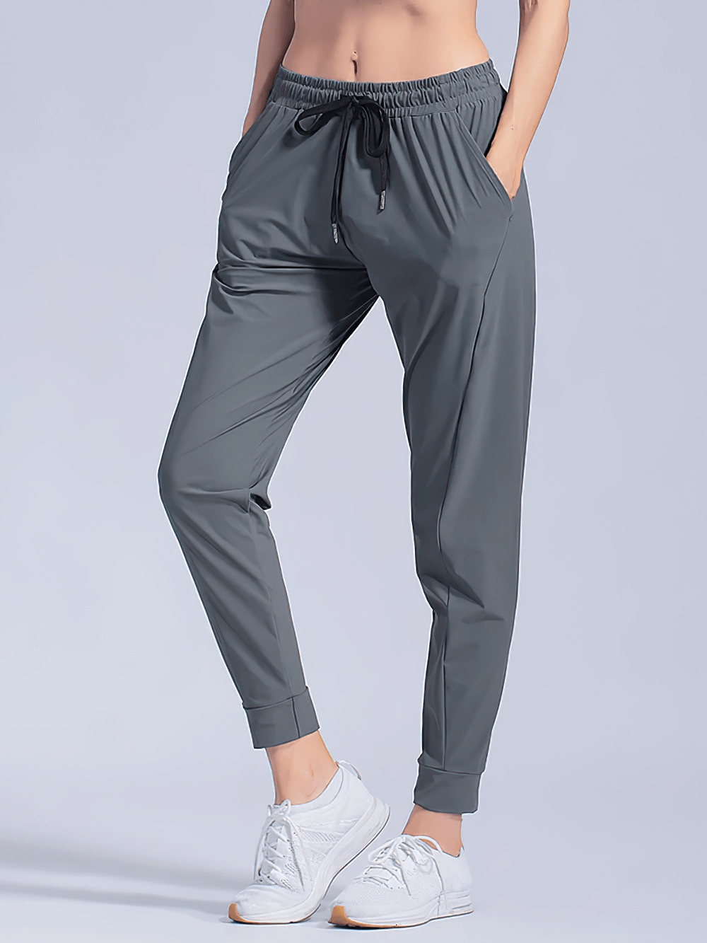 Alt Tag: Quick-Dry Women's Running Pants with Pockets - SF4395 gray joggers with drawstring waist, side pockets, tapered cuffed ankles