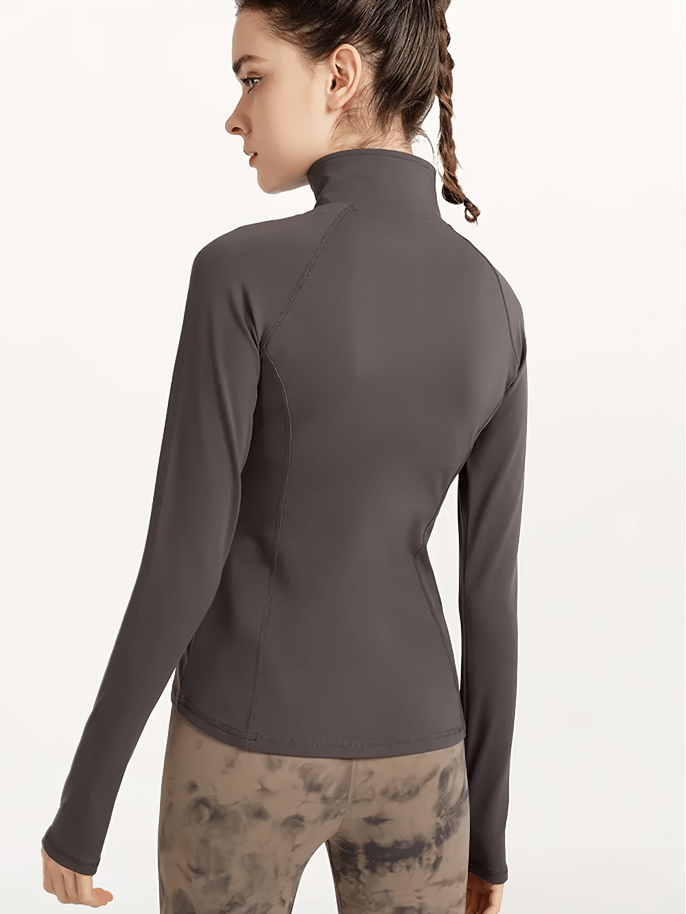 Woman wearing a Quick-Dry Yoga Shirt with Long Sleeves and Half-Zip, breathable nylon and spandex activewear top for fitness and training.