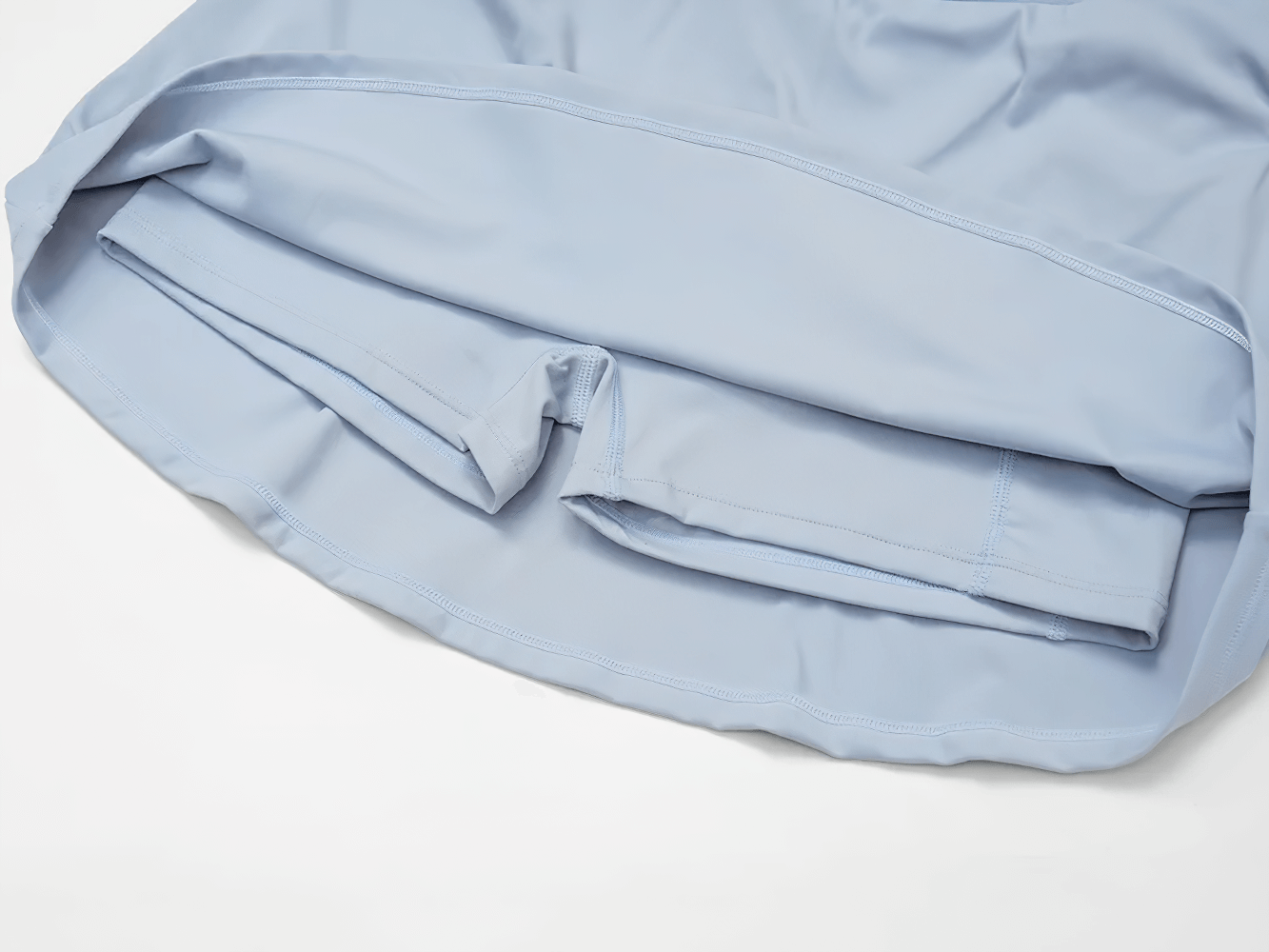 Alt Tag: Quick Dry Yoga Skirt for Badminton and Training - SF4402 close-up of light blue inner shorts and hem stitching, quick-dry sporty fit