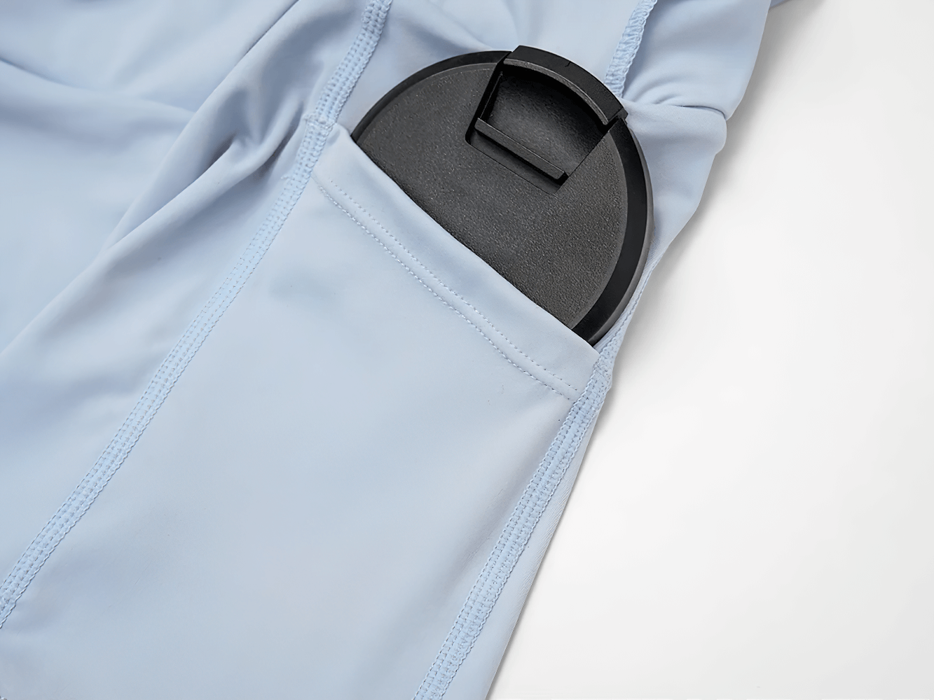 Alt Tag: Quick Dry Yoga Skirt for Badminton and Training - SF4402 pocket detail holding round case, quick-dry athletic fabric close-up