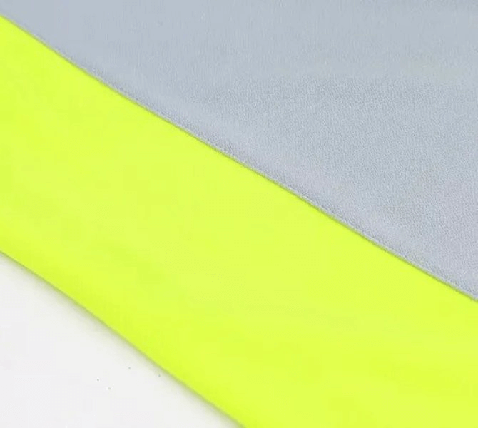 Close-up of quick-drying polyester fabric in grey and neon yellow for men's sports T-shirt SF1772, showcasing breathable material.