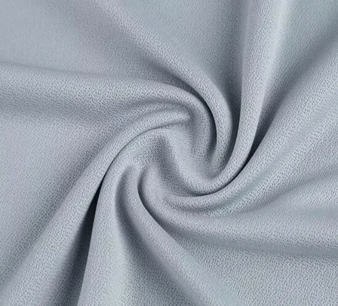 Close-up of gray polyester fabric showcasing its quick-drying and breathable texture, perfect for men's sports T-shirts.