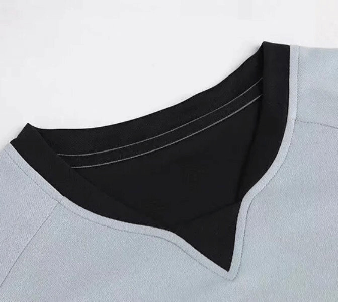 Close-up of a V-neck Quick-drying Elastic Sports Men's T-shirt, highlighting the breathable polyester material and anti-wrinkle design.