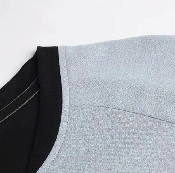 Close-up of a light blue quick-drying elastic sports men's T-shirt, featuring breathable polyester and anti-wrinkle fabric.