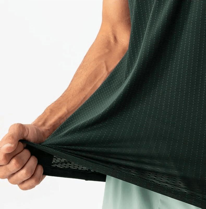 Close-up of a Quick-drying Mesh Sports Men's T-shirt being stretched, showcasing breathable fabric for training.