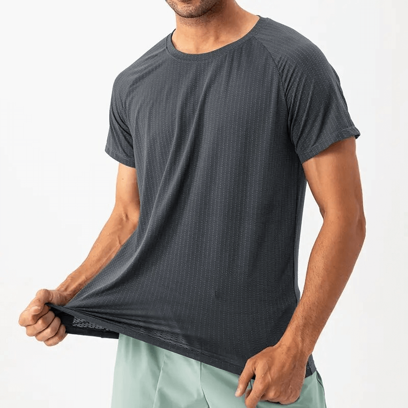 Quick-drying mesh sports men's t-shirt for training, featuring polyester broadcloth and O-neck collar, worn by a male athlete.