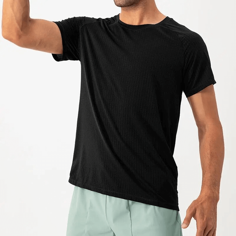 Male athlete wearing a quick-drying black mesh sports t-shirt, perfect for training, featuring an O-neck collar and polyester fabric.
