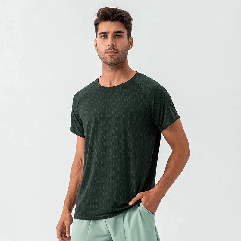 Model wearing a quick-drying mesh sports men's T-shirt, ideal for training, in dark green. Designed for athletic performance, style SF1725.
