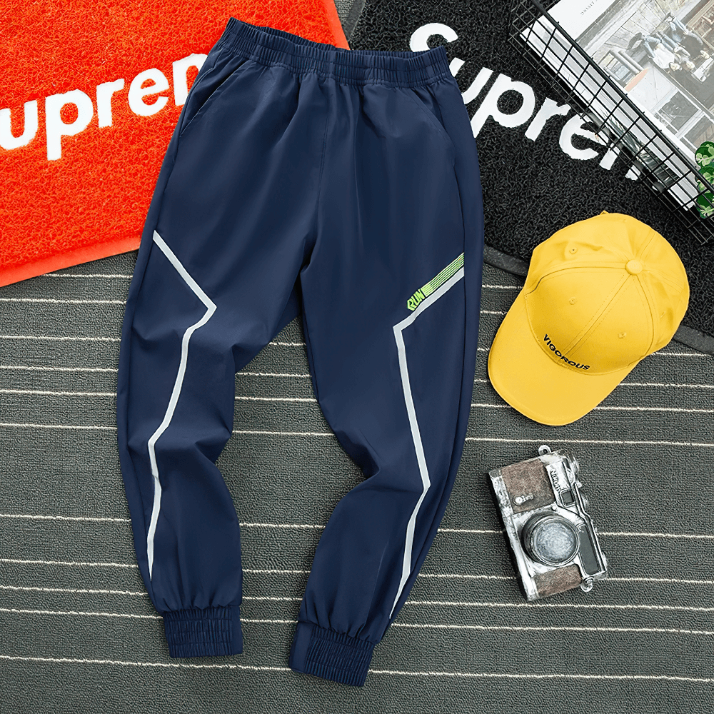 Quick-drying Sports Pants for Boys with Side Pockets - SF3619 displayed on a stylish backdrop with accessories.