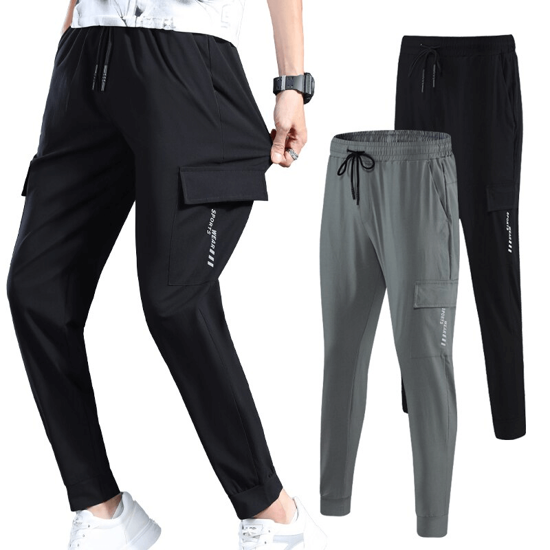 Quick-drying sports pants for men with elastic waistband and side pockets, perfect for running. Available in black and grey. SF1518.