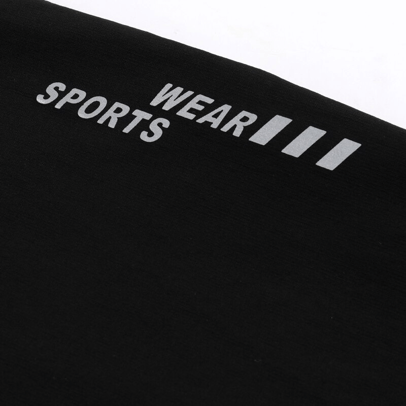 Close-up of black sportswear fabric with white 'Wear Sports' text, showcasing quality material for active use.