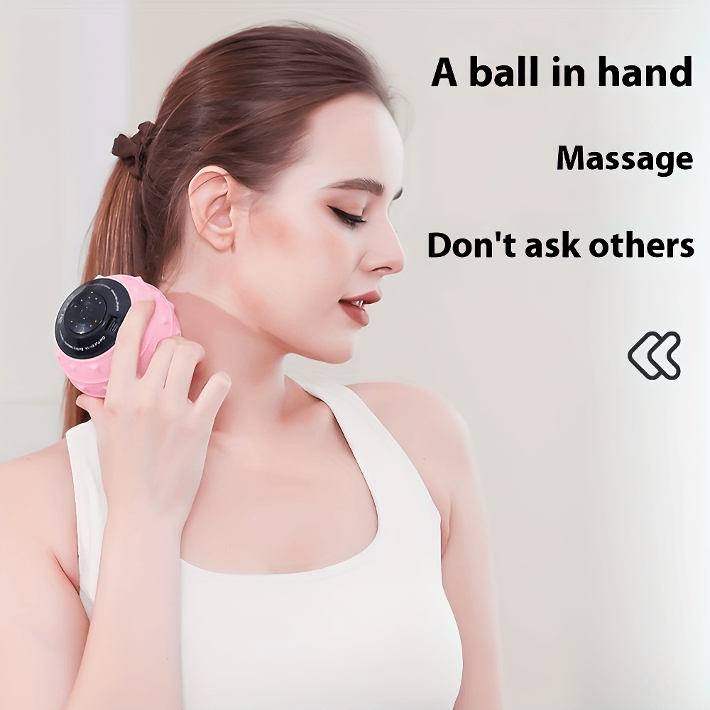 Woman using a rechargeable vibrating massage ball for neck therapy and muscle recovery.