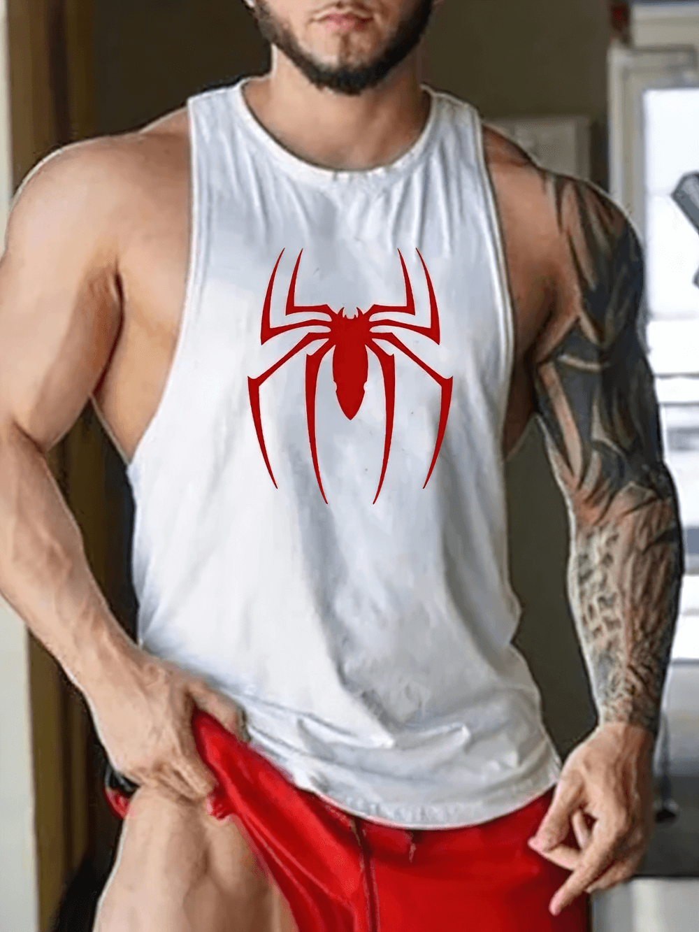 Man wearing Red Spider Printed Running Tank Tops for Gym - SF4112, showcasing bold spider graphic for fitness enthusiasts.