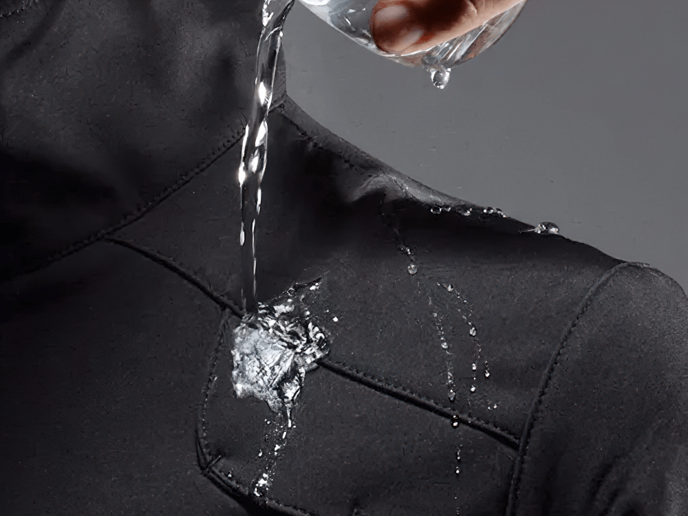 Waterproof thermal cycling jacket showcasing water resistance. Ideal for cold weather and reflective safety in low-light conditions.