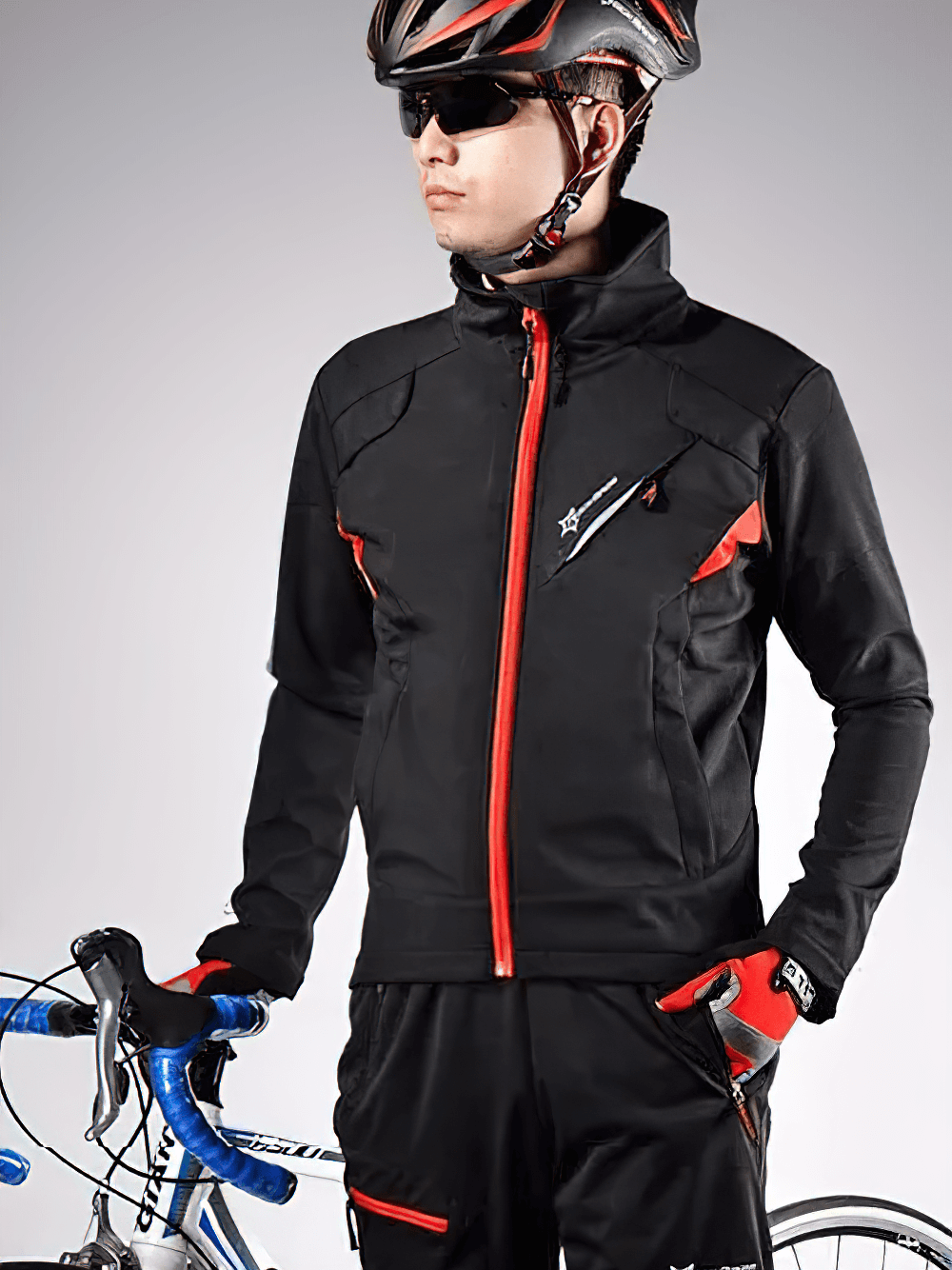 Man wearing reflective thermal cycling jacket and pants set, SF2639. Waterproof, windproof, breathable suit for cold weather rides.