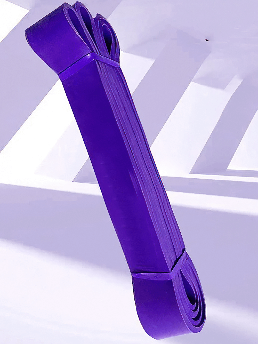Durable purple resistance band for pull ups and stretching, ideal for home workouts, strength training, and physical therapy.