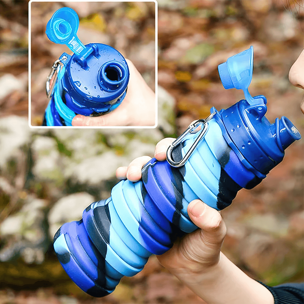Reusable Collapsible Bottle with Carabiner - SF3489 being held outdoors, showcasing its foldable silicone design and carabiner clip.