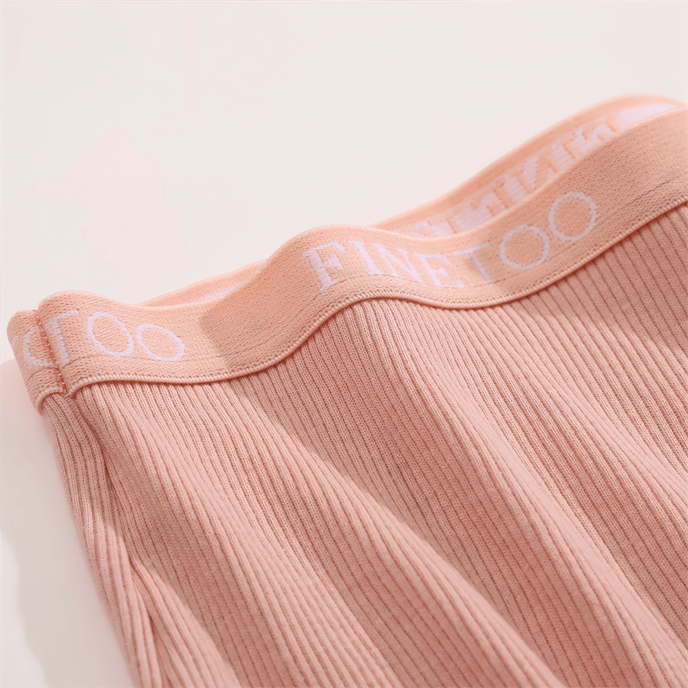 Ribbed boyshort panties with elastic waistband in soft pink, offering full coverage and a sleek silhouette for everyday wear.