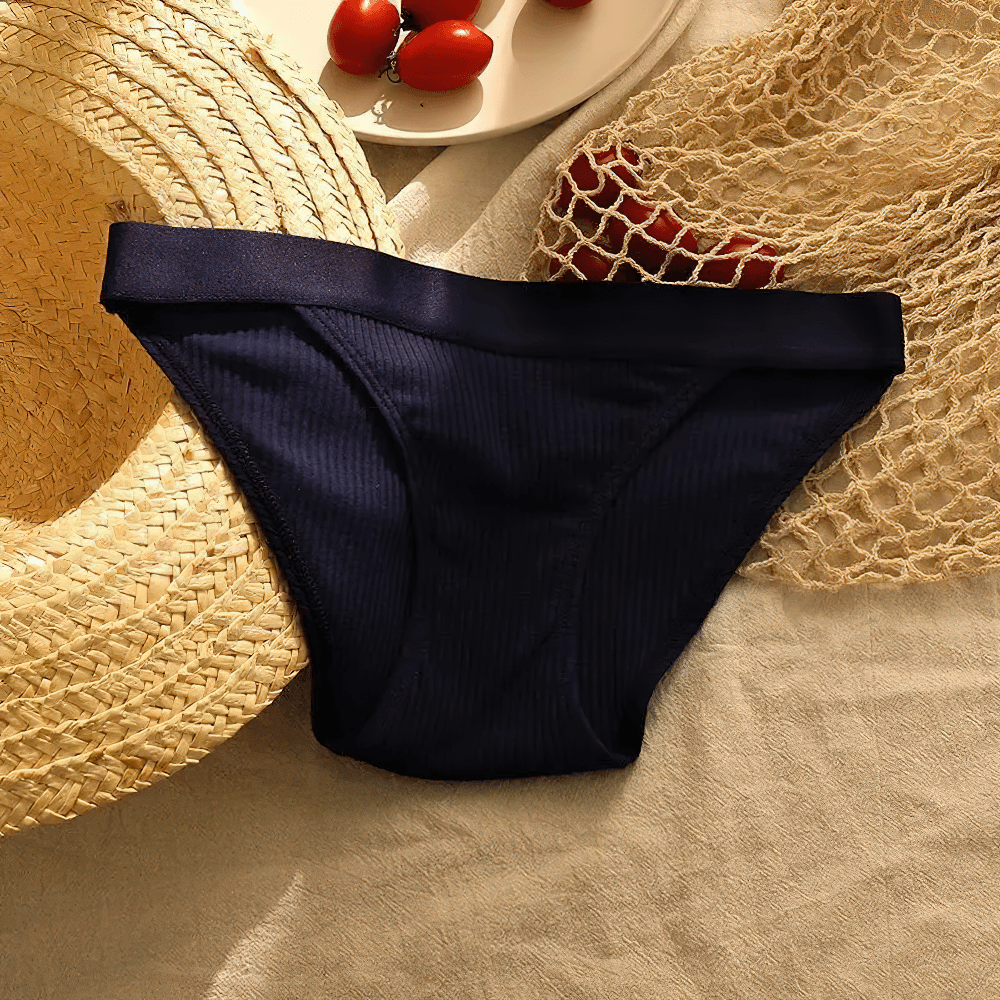 Ribbed Cotton Bikini Brief Panties for Women - SF4633 in navy blue laid on soft fabric with natural elements.