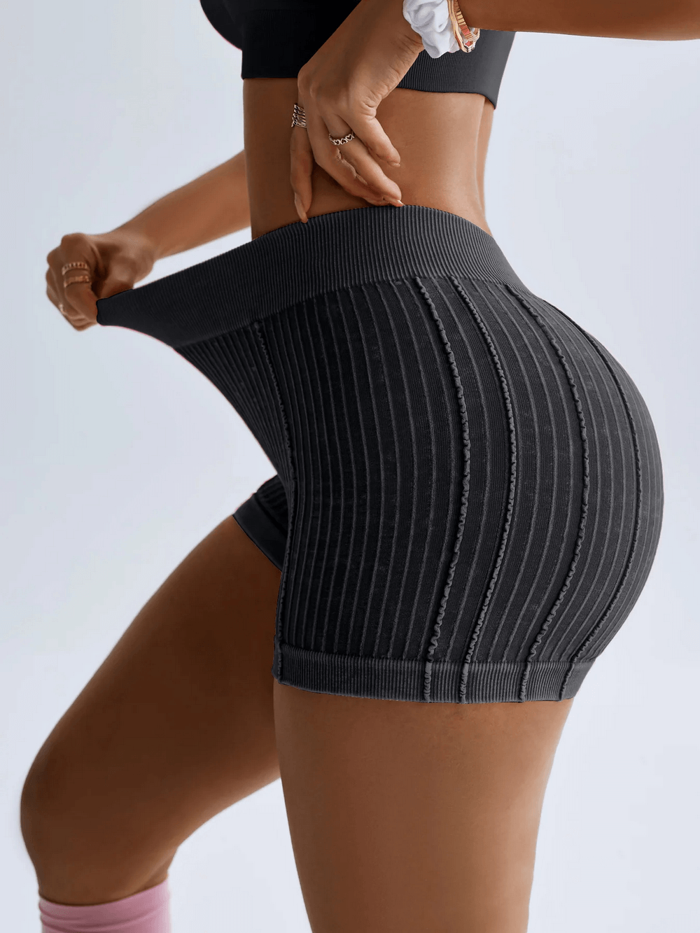 Ribbed Seamless High Waist Scrunch Workout Shorts - SF4159 showcasing the V-waist and textured rib panels in a side profile.