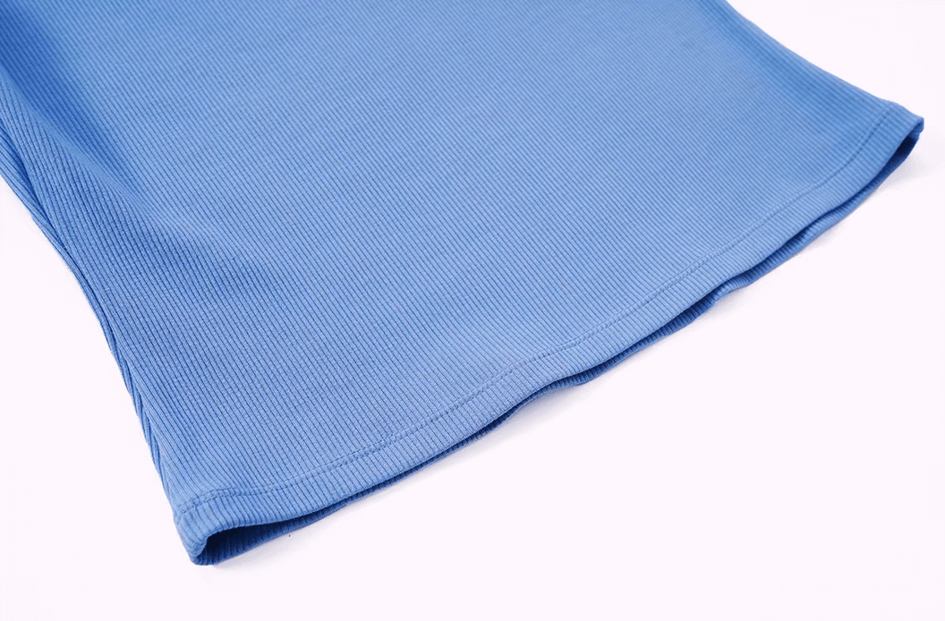 Close-up of blue ribbed short sleeve yoga crop top for women, featuring quick-dry and anti-wrinkle fabric, ideal for workouts.