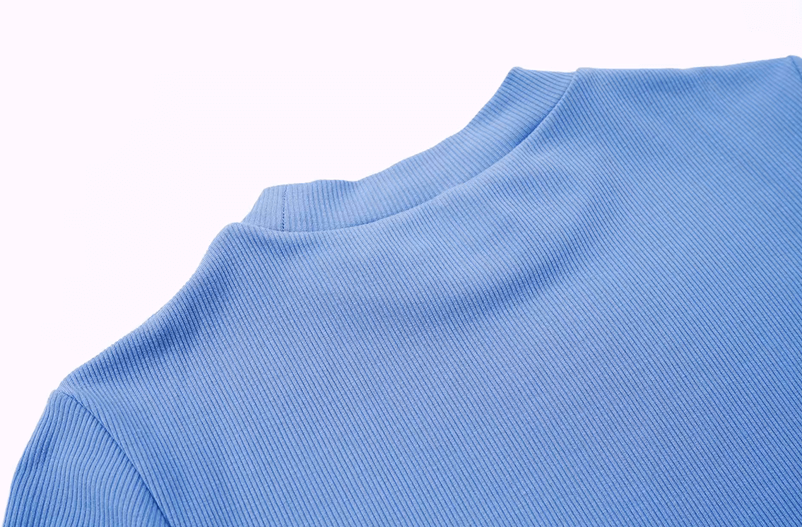Close-up of a blue ribbed short sleeve yoga crop t-shirt showing the textured fabric, perfect for fitness and quick-dry workouts.