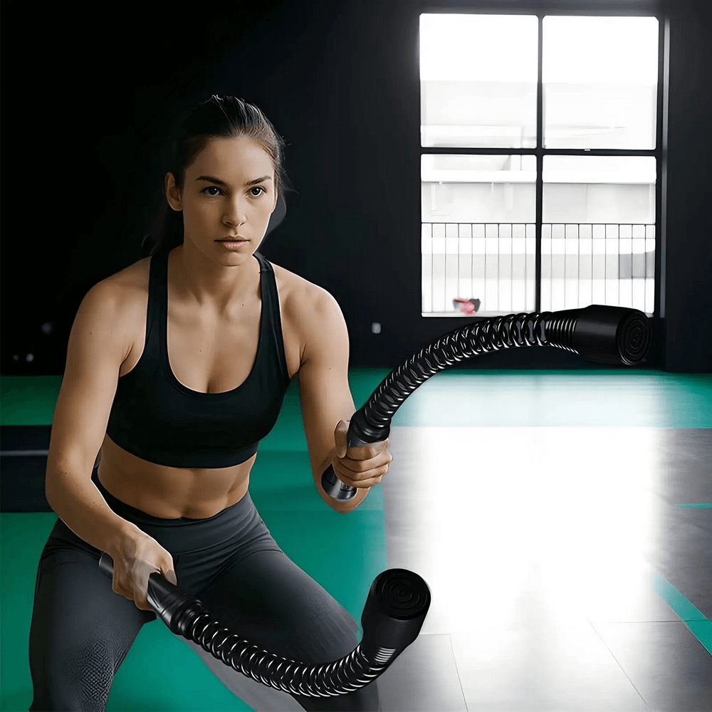 Woman using Ropeless Inertia Training Rope SF3291 for full-body workout in gym