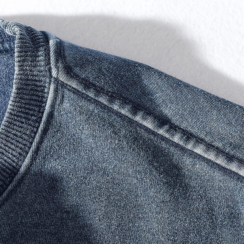 Close-up of blue round neck long-sleeved knitted sports pullover showing detailed stitching - perfect for stylish comfort.