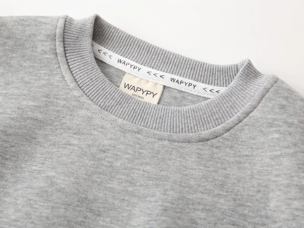 Close-up of a gray Round Neck Sweatshirt with Contrasting Sleeves - SF3550, showing ribbed neckline and soft fabric texture.