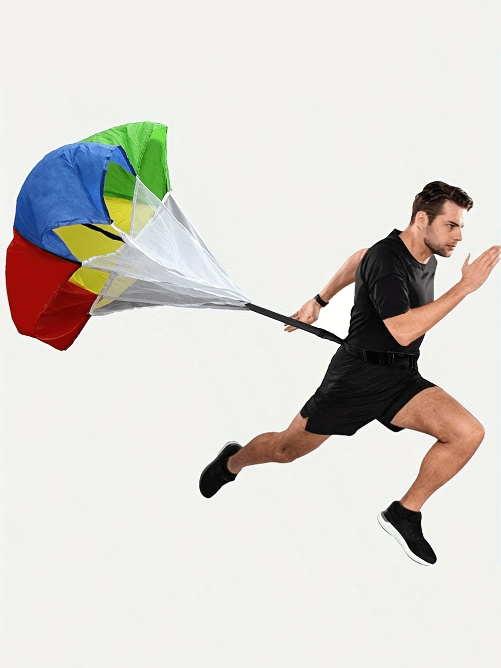 Athlete training with a colorful resistance parachute for speed and agility, enhancing running performance with adjustable SF2792 chute.